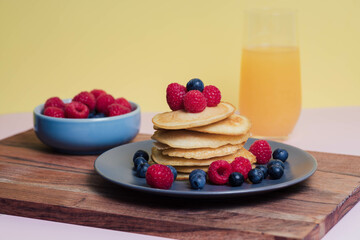 Stack of homemade pancakes for breakfast with berries