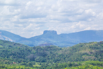 Beautiful view of the famous Sigiriya Mountain (Lion Mountain) among the rainforest, Sri Lanka