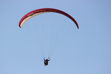paraglider in the sky, zoom focus close shot