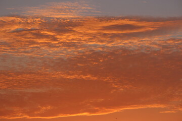 red sunset sky in the clouds, golden hour abstract clouds