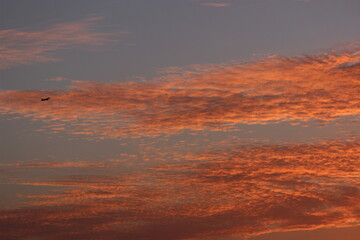 red sunset sky in the clouds, golden hour abstract clouds