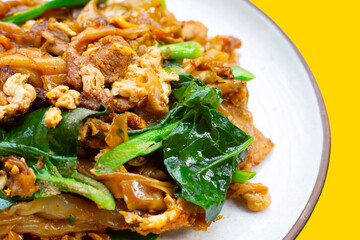 Stir-fried rice noodles with soy sauce and pork