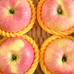 beautiful pink apple in yellow wrap bubble, healthy fruit in the box