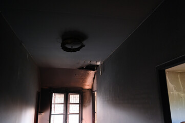burn interior house with window and cement wall, old scary home