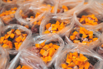 Process of preparing bowls with natural raw pet dog food at home, preparation of healthy raw barf for cats dogs, with duck, turkey, offals, meat, vegetables, assorted fresh portions in containers bags