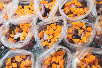 Process of preparing bowls with natural raw pet dog food at home, preparation of healthy raw barf for cats dogs, with duck, turkey, offals, meat, vegetables, assorted fresh portions in containers bags