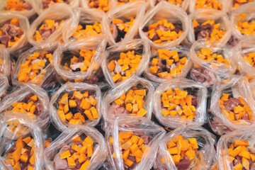 Process of preparing bowls with natural raw pet dog food at home, preparation of healthy raw barf for cats dogs, with duck, turkey, offals, meat, vegetables, assorted fresh portions in containers bags