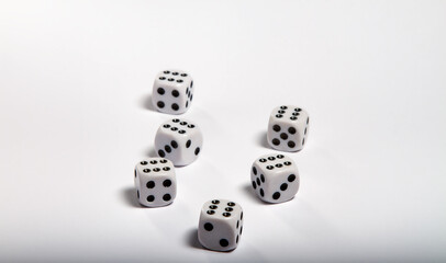 Game data. Focus on the first dice, blurring behind with white background. Table game. Board game. Casino game. Dots.