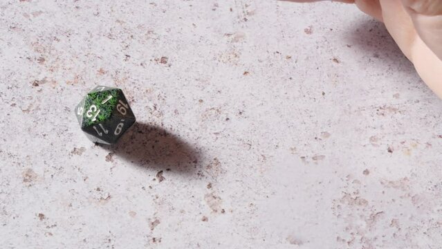 Rolling a one - the worst score - on a twenty-sided die in a tabletop roleplaying game