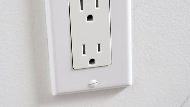 Unplugging an extension cord or appliance power cord from the wall outlet