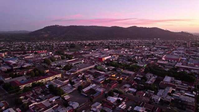 Aerial Drone Above Temuco, Chile, Sunrise Time, Hills, Houses and Town Streets, Pink Skyline Horizon, Cautin Province