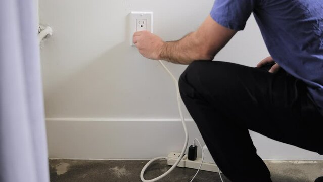 Plugging in a cord to charge batteries and other devices