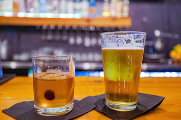 Close up shot of cold beer and Whiskey