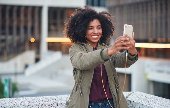 Black woman, city and selfie with smile, smartphone and happiness for social media profile picture. Happy gen z girl, african and phone for blog, post or networking app on rooftop balcony for travel
