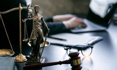 Legal services concepts. The Statue of Justice - lady justice or Iustitia, lawyer working at office.