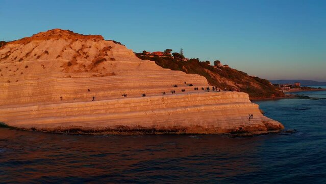 Aerial View Of Scala Dei Turchi Bathed In Orange Sunset Light. Parallax Shot