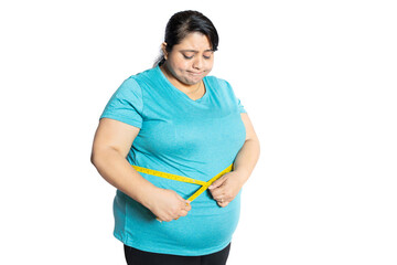 Sad overweight indian woman check belly fat with measuring tape isolated over white background....