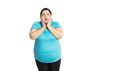 Surprised overweight indian woman with open mouth standing isolated over white background, Copy...