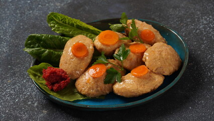Gefilte fish with carrots, lettuce, horse radish. Passover traditional Jewish food - celebration concept