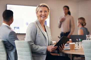 Portrait, business and senior woman in meeting, tablet and planning for advertising campaign, online sales and discussion for growth. Face, female leader and staff brainstorming for budget and ideas