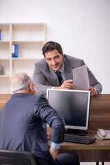 Two male colleagues working in the office