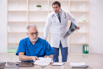 Two male doctors radiologists working in the clinic