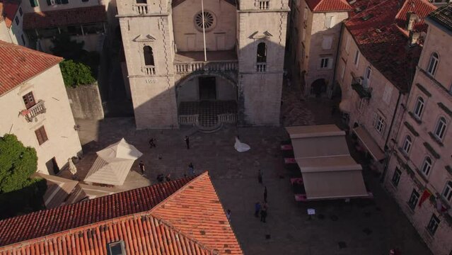 Romantic photoshoot of married couple in front of Cathedral of Saint Tryphon, Kotor