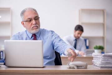 Two male colleagues working in the office