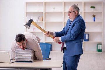 Old male boss and young male employee in bullying concept