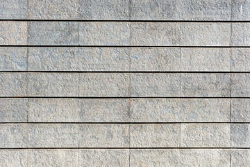Background from a wall made of gray granite stones