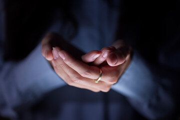 Dark, showing and hands of a business person for product placement, promotion and marketing. Advertising, show and zoom on the palm of a corporate employee for branding and logo late at night