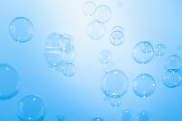 Blue Soap Bubbles Abstract Background. Soap Sud Bubbles Water.