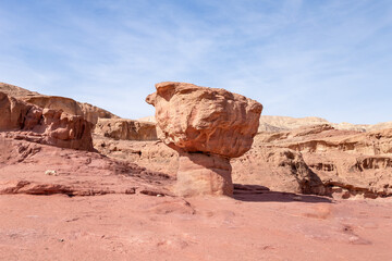 Fototapeta premium Mushroom rock, a rock formed by the erosion of red sandstone in the national park Timna, near the city of Eilat, in southern Israel