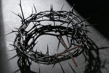 Fototapeta na wymiar Crown of thorns with nails on dark background. Good Friday concept
