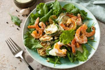 Healthy food concept. Vegetarian vegetable low carb lunch bowl. Diet salad shrimps with arugula, grilled zucchini and walnut.