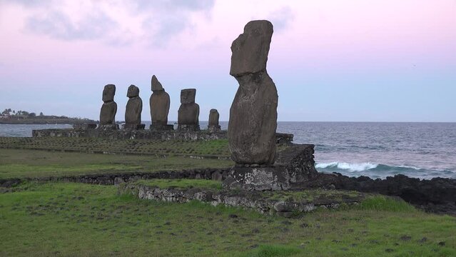 Statues on Easter Island. Mysterious Giant megalith Moai statues. CLOSE UP: Spectacular volcanic sculptures with human faces.Monoliths with intriguing faces on secluded exotic island.
