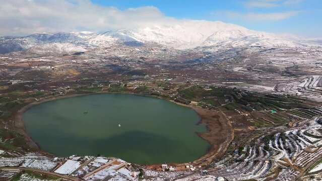 Israel Hermon mountain covered with snow and Ram lake, Drone footage