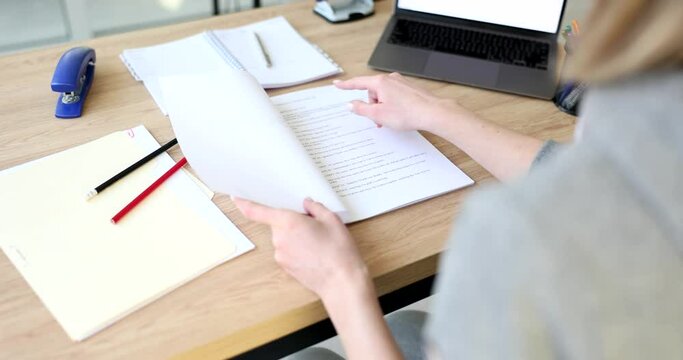 Woman opens script and reads plot of new film