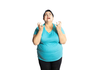 Frustrated overweight indian woman standing over white studio background, Plus size female with sad...