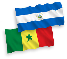 Flags of Republic of Senegal and Nicaragua on a white background