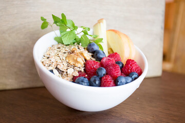 Breakfast bowl with assorted fruit with berries, mango and kiwi.