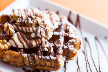 A waffle, also cited with the foreign words waffle, wafol, wafel or waffle, is a typical Belgian...