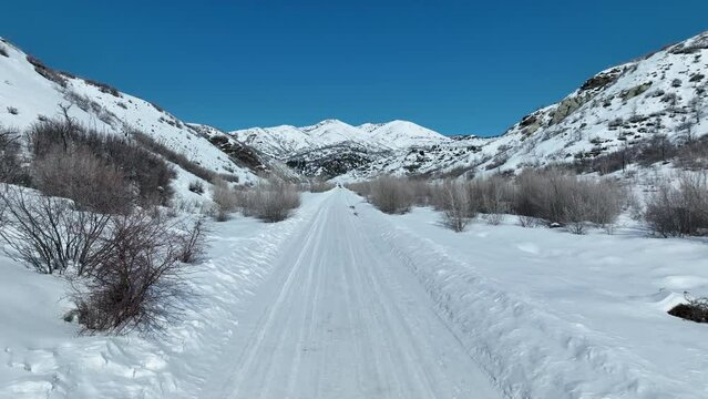 Aerial mountain canyon winter road snow covered. Nebo Scenic Byway, Utah, national drive for beauty and nature. Beautiful season winter snow.  Travel destination. Rugged alpine wilderness.