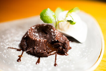 Coulant. Molten chocolate cake is a popular dessert that combines the elements of a flourless chocolate cake and a soufflé. Other names used are chocolate lava cake and chocolate volcano.