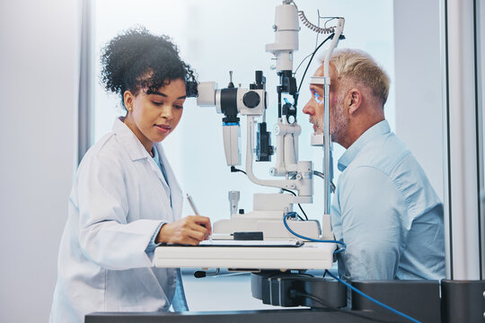 Vision, eye exam and writing with a doctor woman or optometrist testing the eyes of a man patient in a clinic. Hospital, medical or consulting with a female eyesight specialist and senior male
