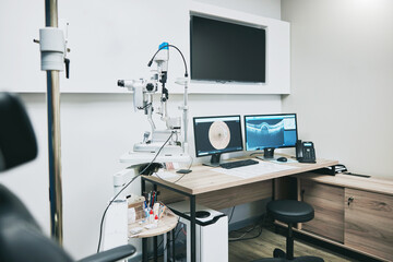 Ophthalmology, computer and empty room with equipment for vision, healthcare and consultation....