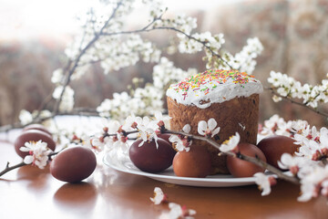 easter cake and red eggs on rustic wooden table. Top view.