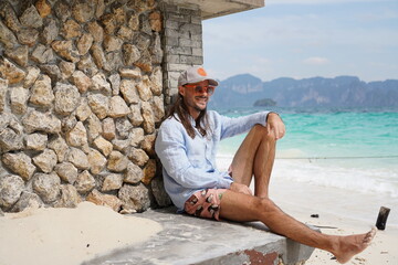 portrait of a man on the beach in krabi thailand with sunglasses