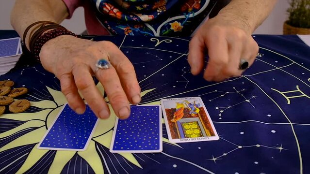 Fortune teller woman reads tarot cards. Selective focus.
