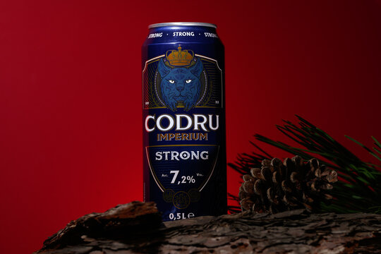 Bucharest, Romania February 2023. Codru is a Romanian beer, both lager and strong, is a beer brand with different flavors. Red background for editorial concept.